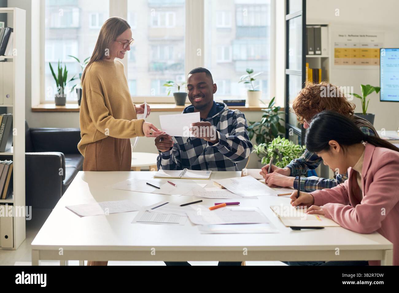 Studying Foreign Languages in Modern Classroom Environment Stock Photo