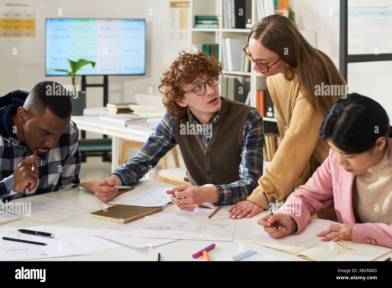 Studying Foreign Languages in Diverse Classroom Setting Stock Photo