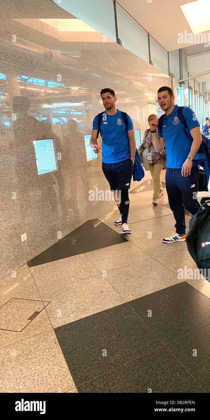Porto football team in shirts and shoes matching Portugal players play shirt blue colour colours walking airport visit work working men mens playing - Smartphone Captured Stock Image