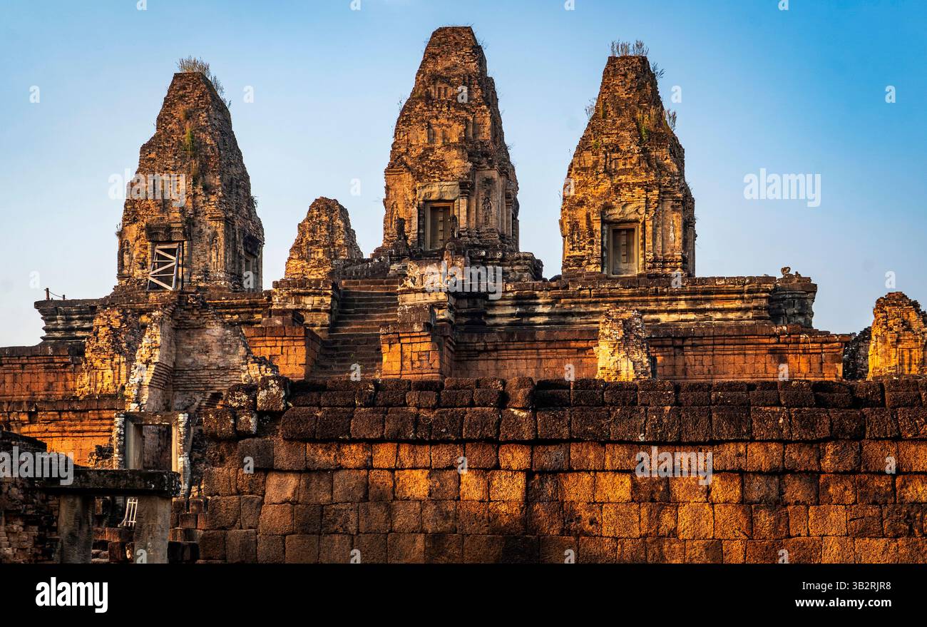 Ancient temple ruins with three prominent towers, surrounded by stone ...