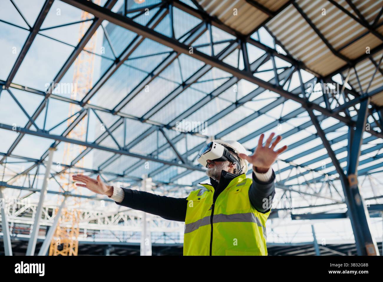 Engineer using virtual reality to inspect building progress. Stock Photo