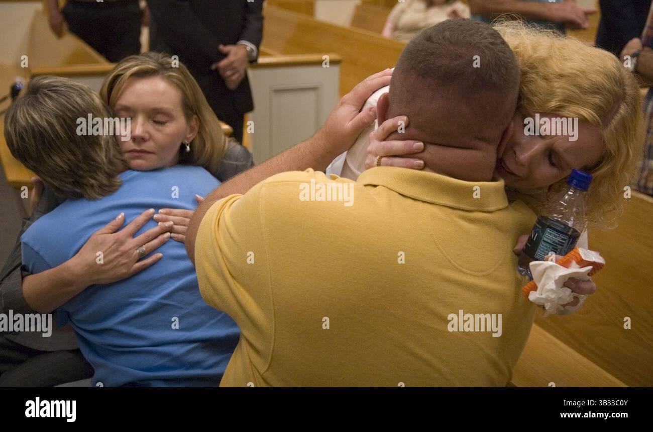 September 17, 2007 - Kingston, TN, USA - HYATTE3.JH#8414.jpg Dean Harris (cq and yes a woman) at right, hugs Dennis Morgan, son of slain Tennessee Corrections officer Wayne Cotton Morgan, as victim witness coordinator Julia Bebb, facing camera, and consoles Viann Morgan, back to camera after Jennifer Hyatte plead guilty to his killing Monday at the  Roane County Courthouse. Dean Harris's husband Larry Hariis was working with Morgan the day his was shot.   News Sentinel photo by Joe Howell (Credit Image: © Joe Howell/Knoxville News Sentinel via ZUMA Wire) Stock Photo