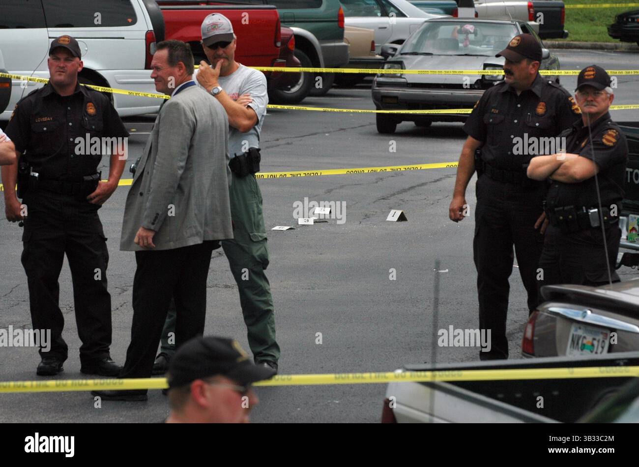 August 9, 2005 - SHOOTING1.JH#1.JPG METRO 08/09/05 NEWS SENTINEL PHOTO BY JOE HOWELL Shell casings are marked with numbers at the scene of a shooting at the Roane County Courthouse that left a correction office dead and two suspects on the loose. Correction officer Wayne ''Cotton'' Morgan died at the University of Tennessee Medical Center after being shot three times in the parking lot of the courthouse, according to authorities. (Credit Image: © Knoxville News Sentinel via ZUMA Wire) Stock Photo