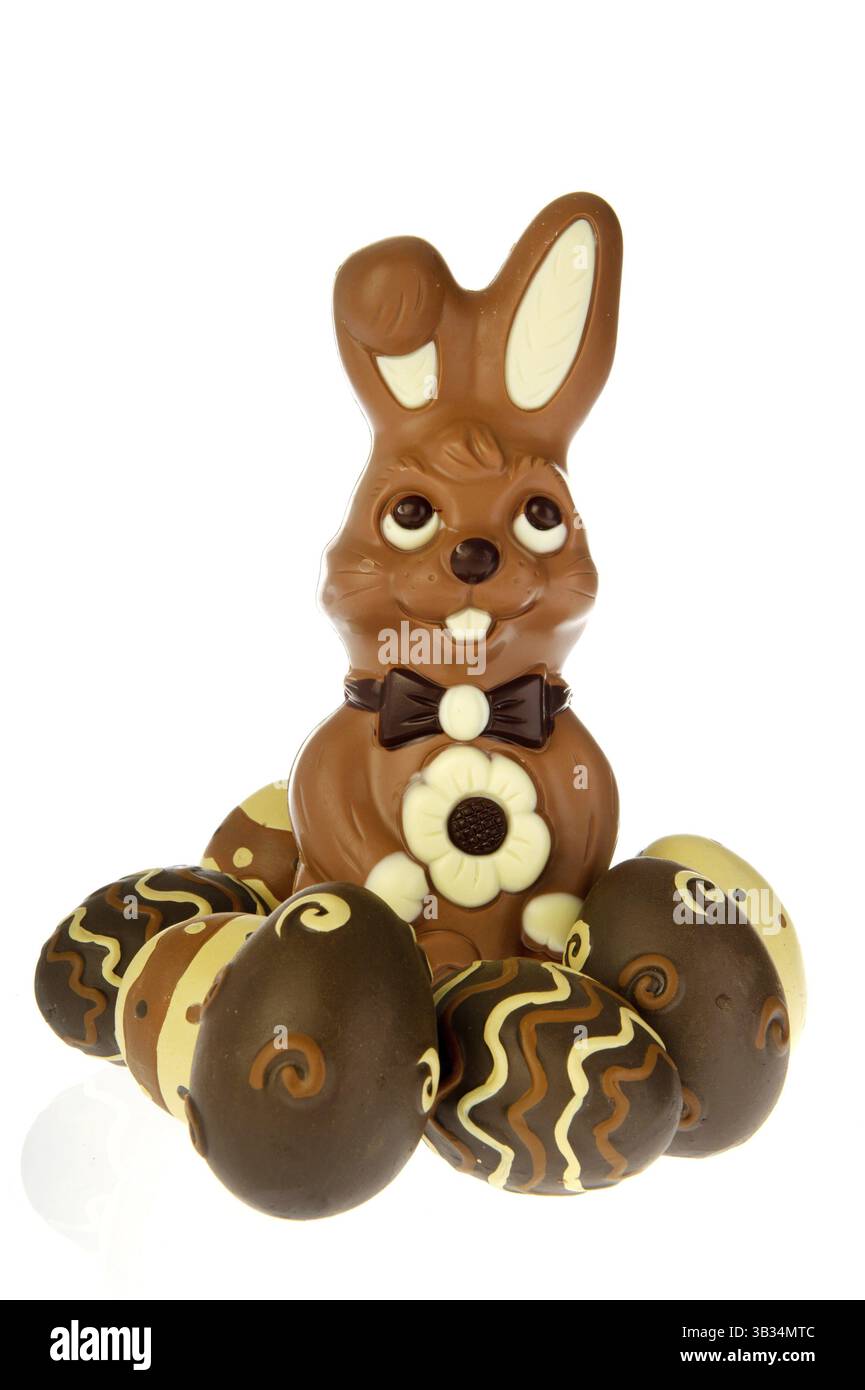 Chocolate easter bunny with eggs on white background Stock Photo