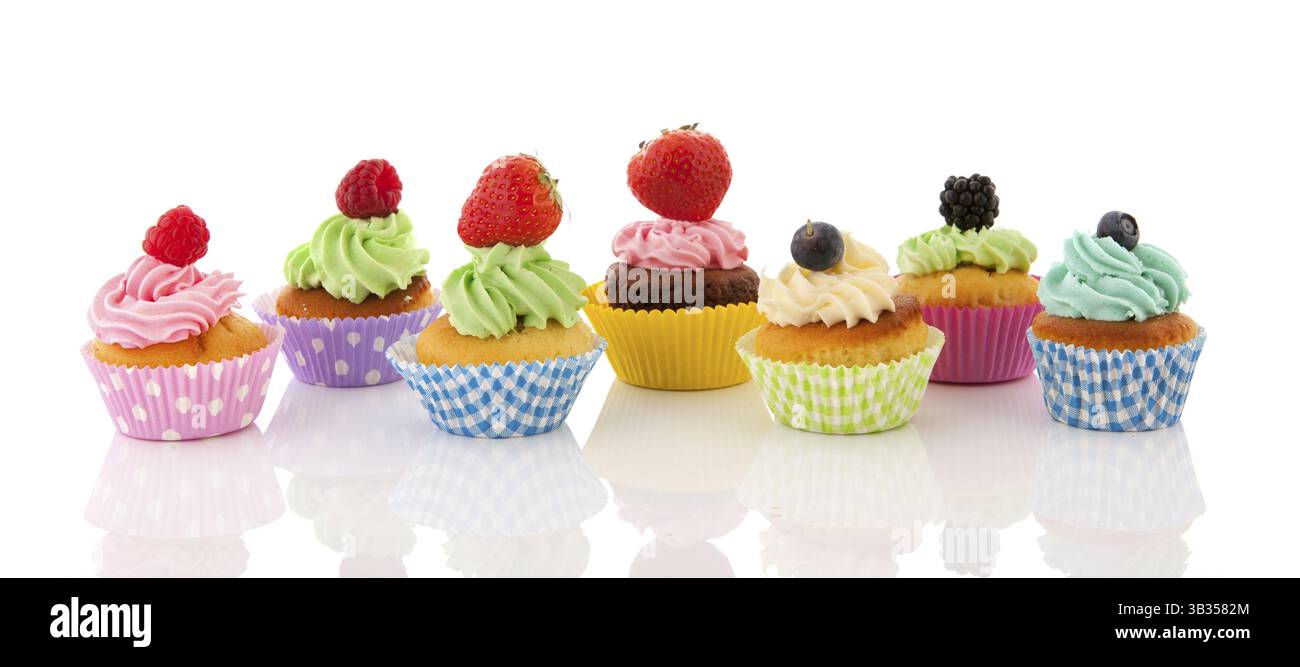 Fresh fruit cupcakes isolated over white background Stock Photo