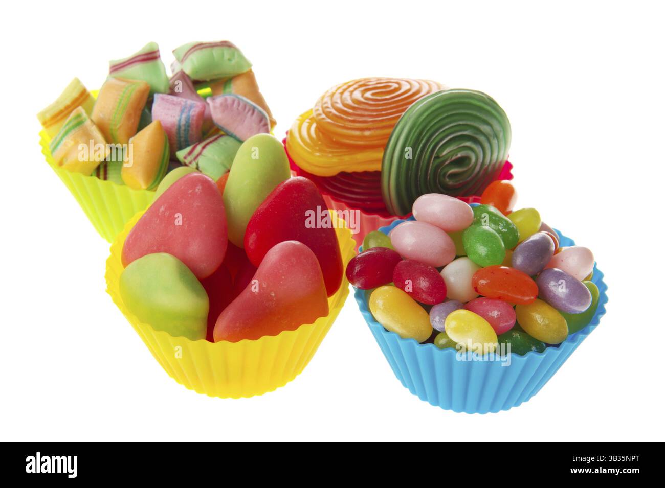 Four colorful cups full with assortment candy Stock Photo