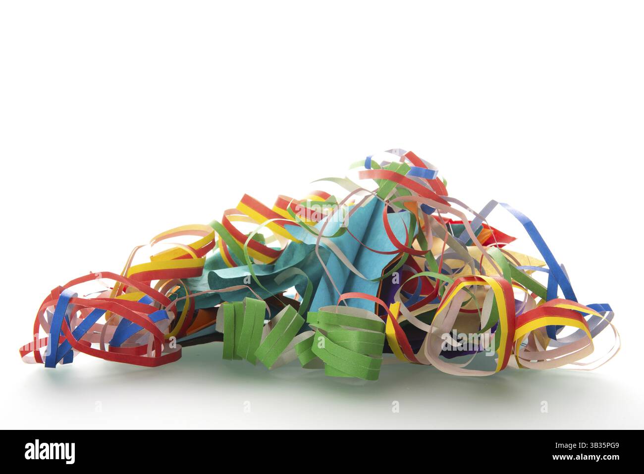 Pile of paper streamers isolated over white background Stock Photo - Alamy