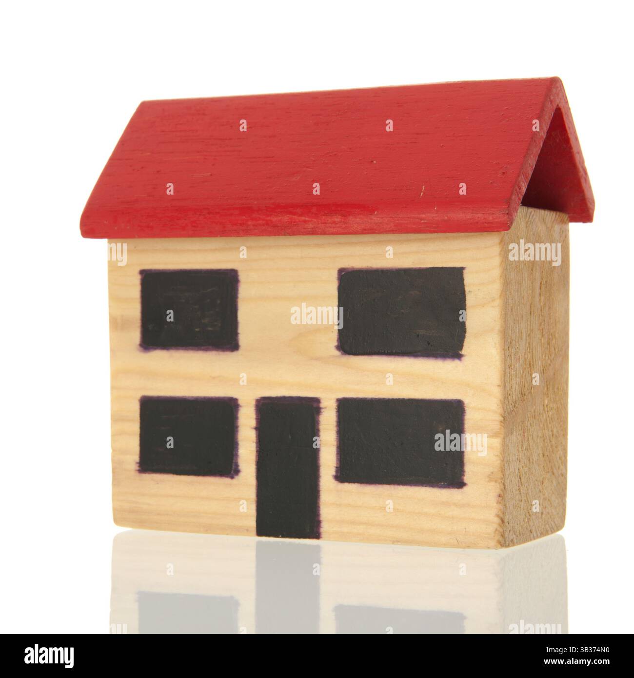 Wooden miniature house isolated over white background Stock Photo - Alamy