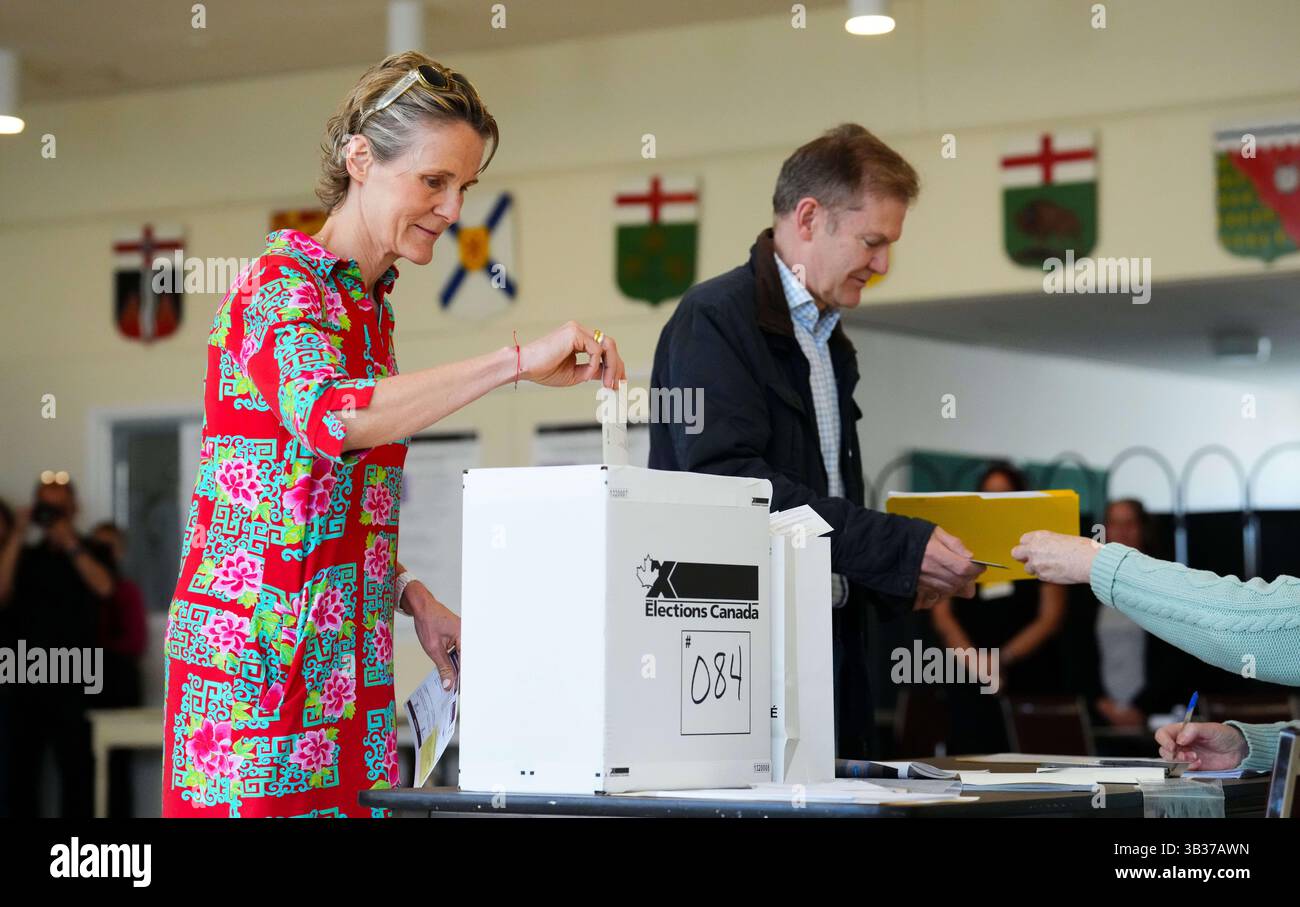 Diana Fox Carney, left, votes in Ottawa, Ontario, Monday, April 28