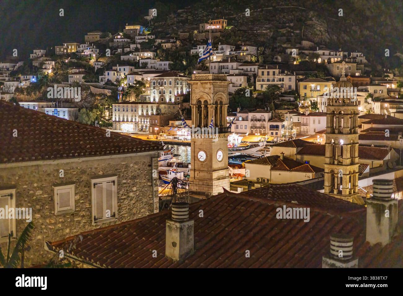 Hydra, Greece town at night, with houses reaching up the hill. Stock Photo