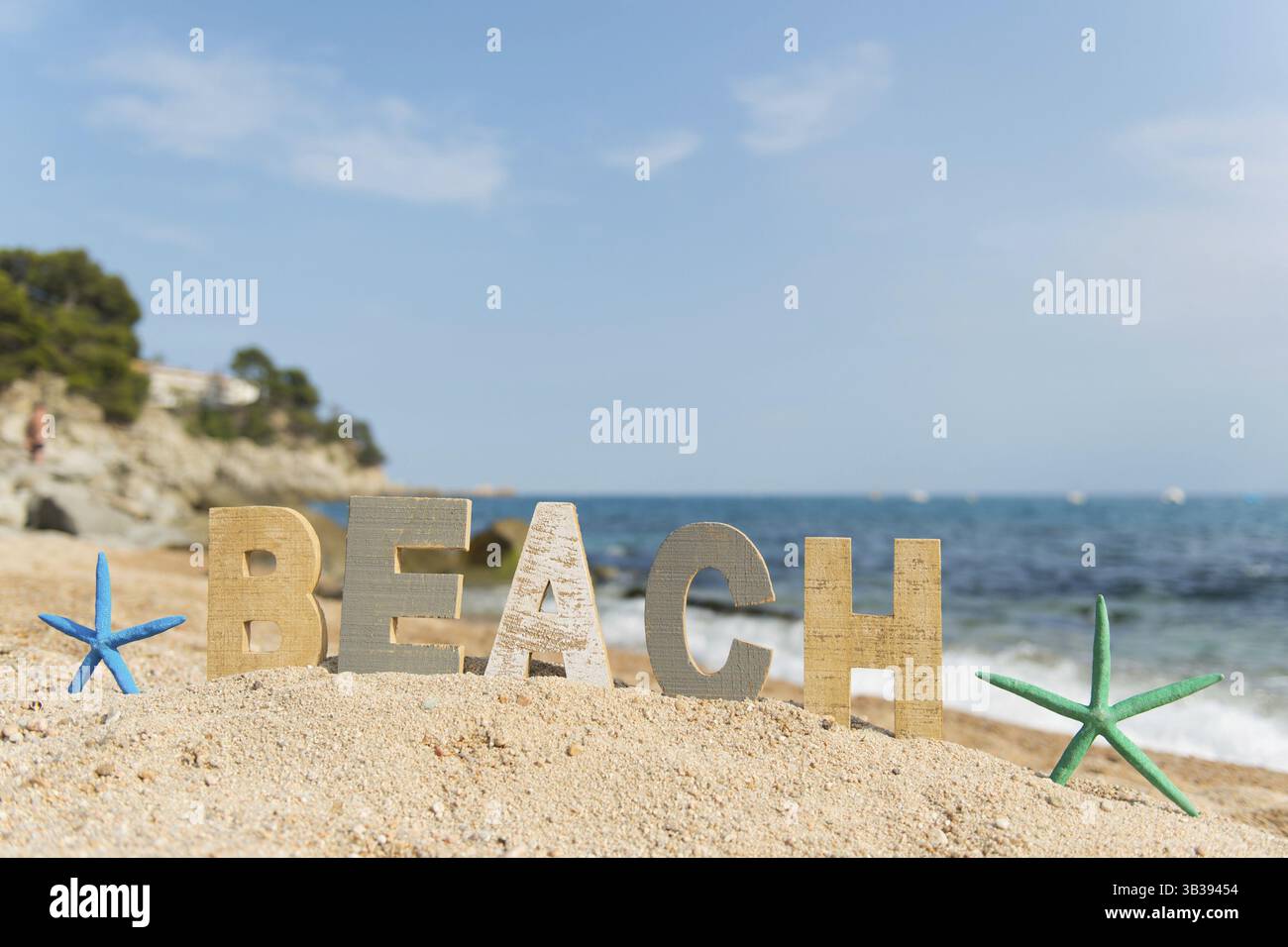 Vintage wooden letters with word at the beach Stock Photo - Alamy