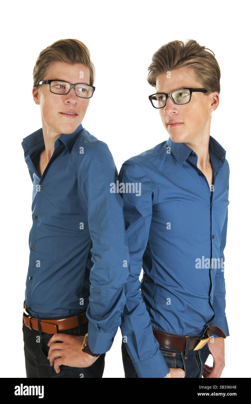Identically adult male twins in studio Stock Photo - Alamy