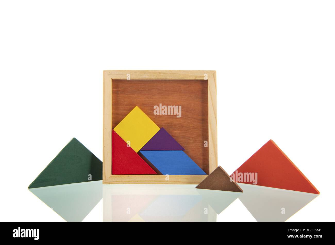 Colorful wooden puzzle isolated over white background Stock Photo - Alamy