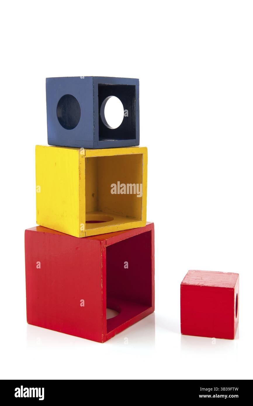 Stacked wooden toy blocks isolated over white background Stock Photo ...