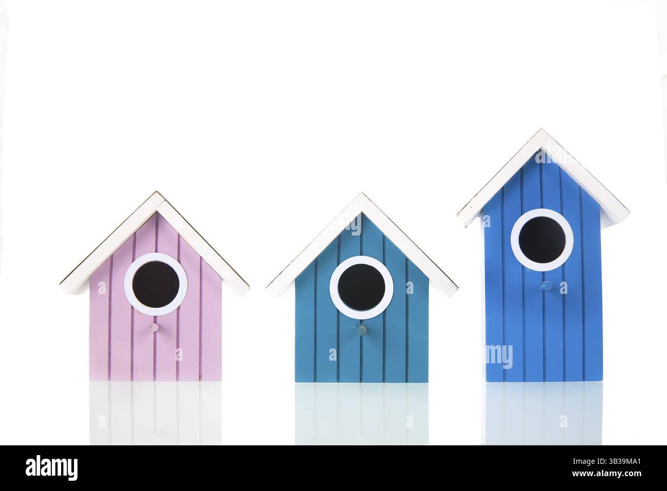 Many colorful bird boxes isolated over white background Stock Photo
