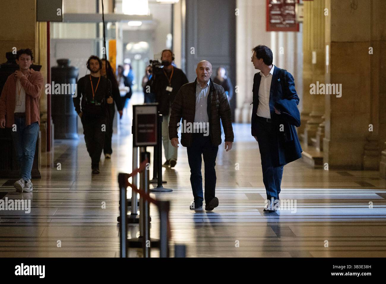 Accused robber Yunice Abbas and his lawyer Gabriel Dumenil arrive for ...