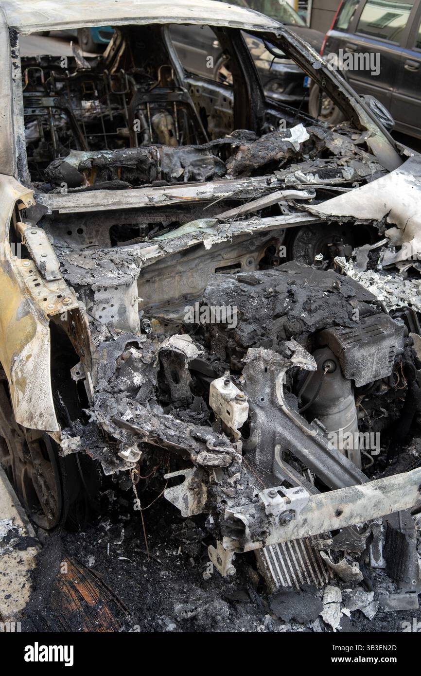 Cars burnt in Eksarchia district after clashed between anarchists and the police. Stock Photo