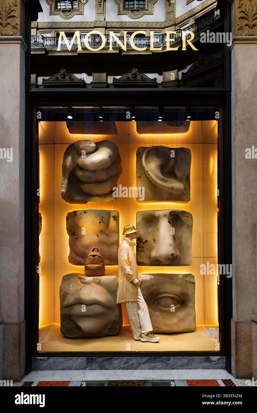 Milan, Italy - 20.05.2024: Storefront of Moncler featuring mannequin dressed in beige outfit Stock Photo