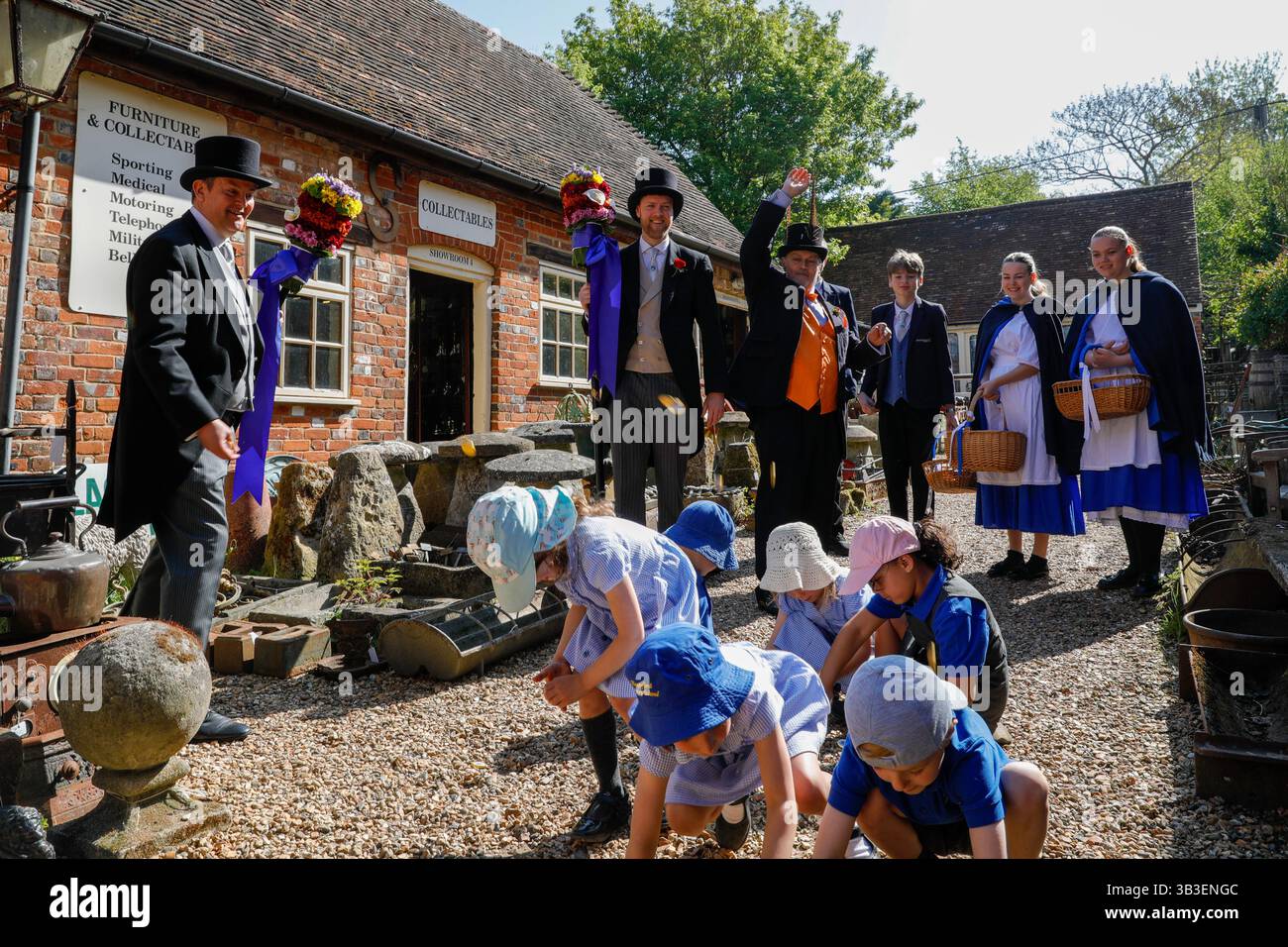 Hungerford, Berkshire, UK. 29 April, 2025. Hocktide, Tutti Day, Hungerford, Berkshire, UK. In the past hot coins would have been thrown to children, now the Tutti Men throw chocolate coins Credit: Red Water Images/Alamy Live News Stock Photo