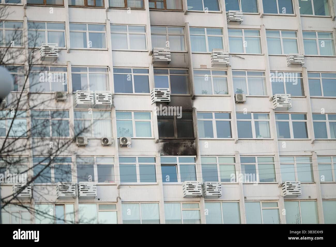 Consequences of a fire in a multi-storey building. Damaged multi-storey ...