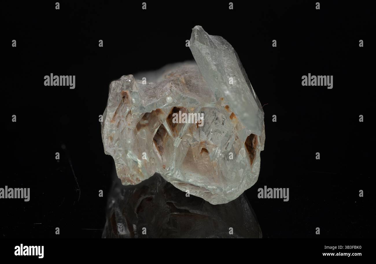 Translucent Beryl close-up view of a rough, translucent natural beryl crystal displaying ...