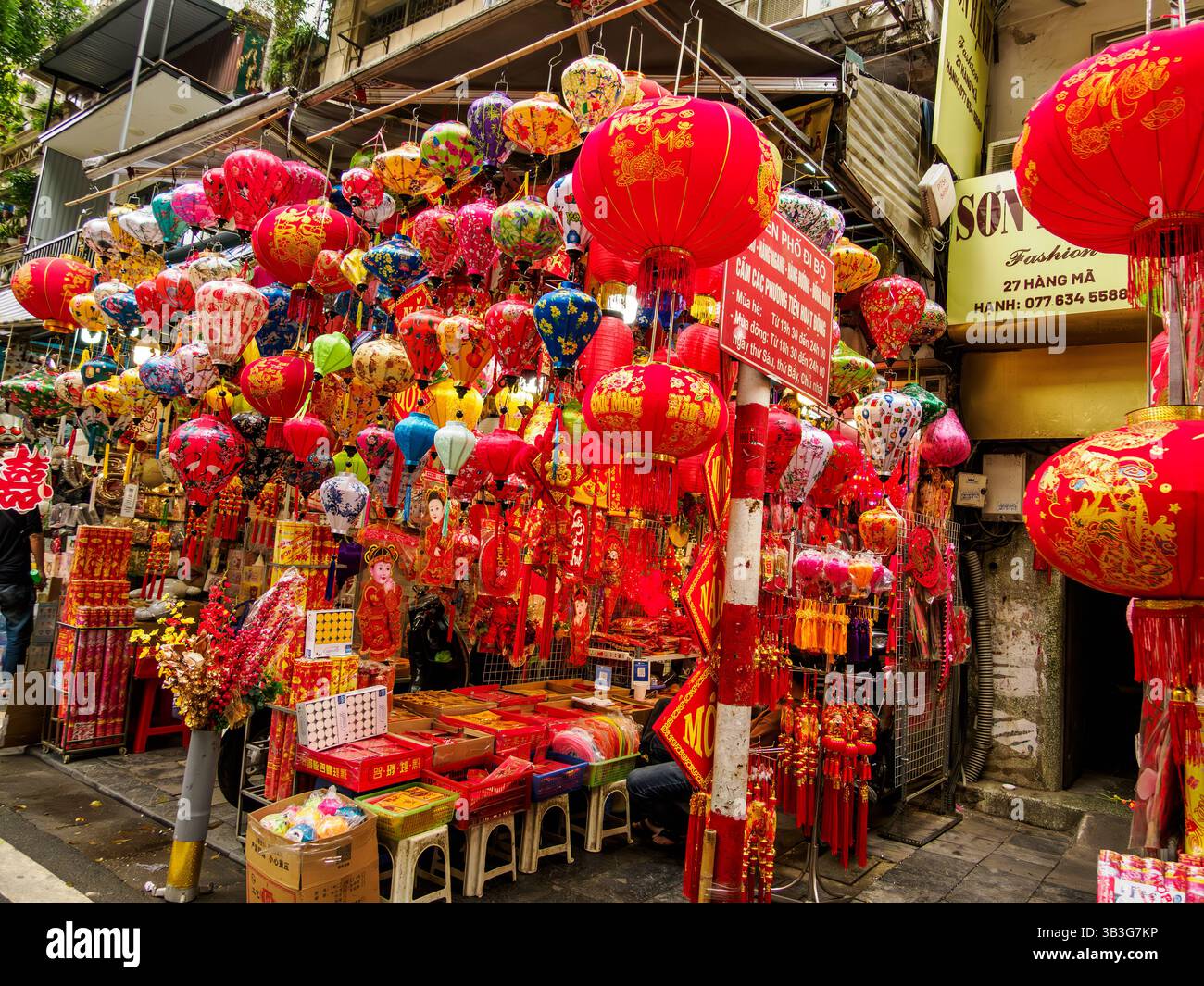 Storefront with bright red decorations for sale - Hanoi, Vietnam Stock Photo