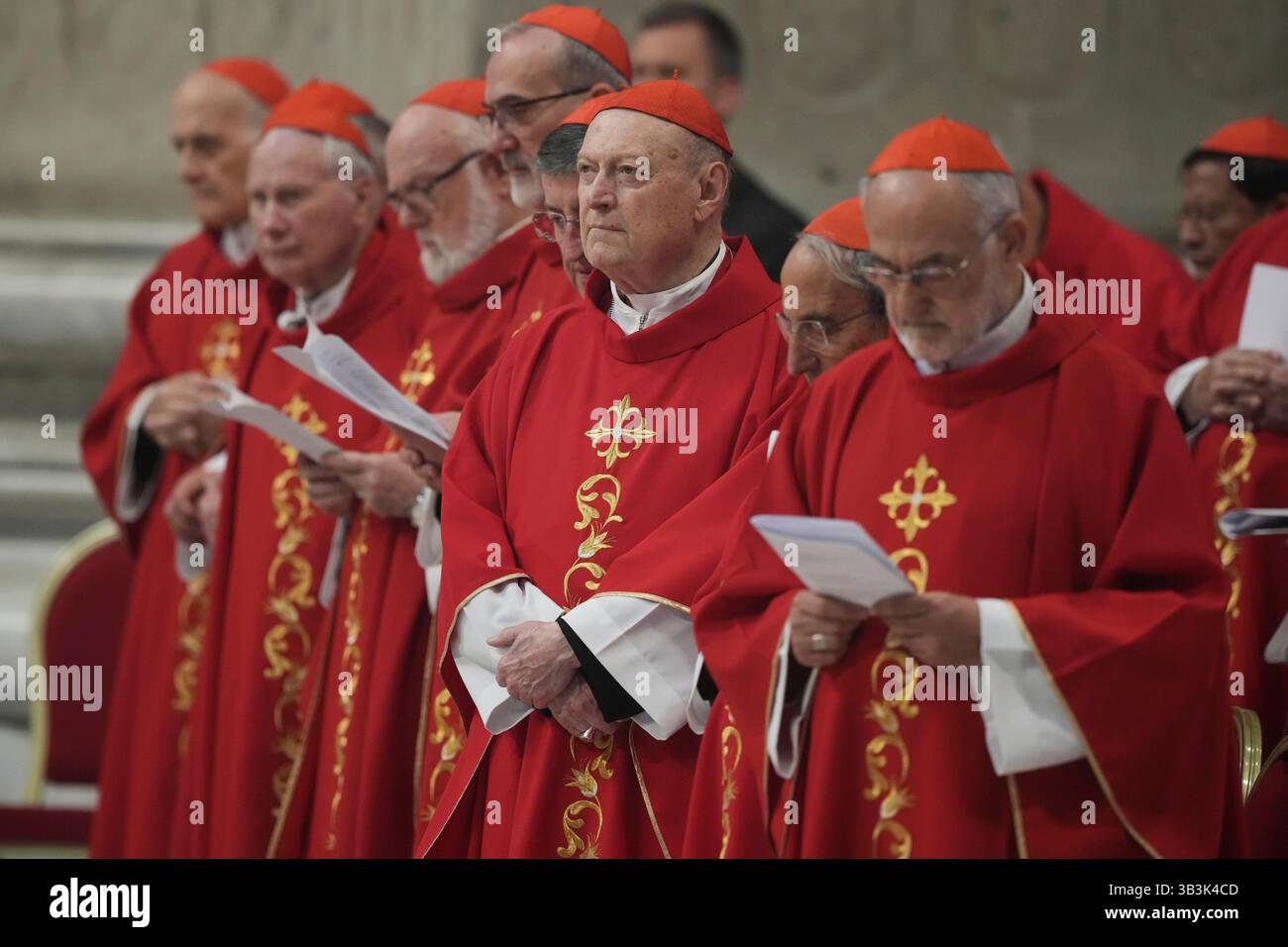 Cardinal Gianfranco Ravasi, center, along with others, attends a mass ...