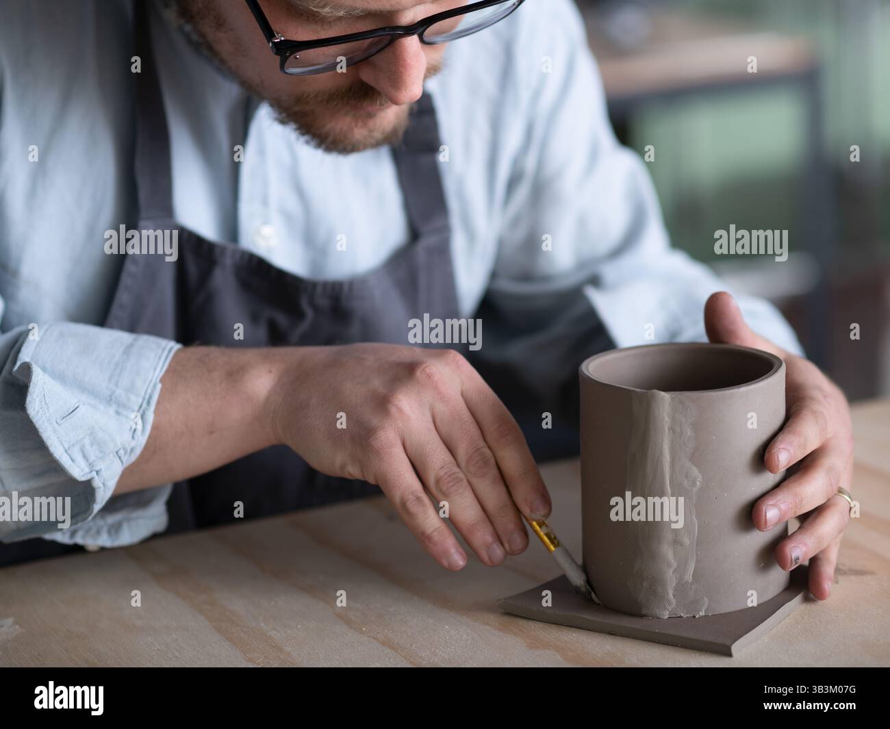 Ceramic artists working in pottery studio Stock Photo
