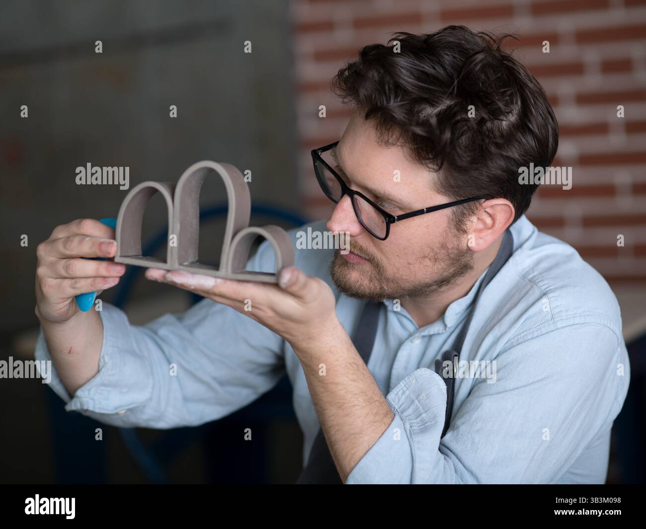 Ceramic artists working in pottery studio Stock Photo