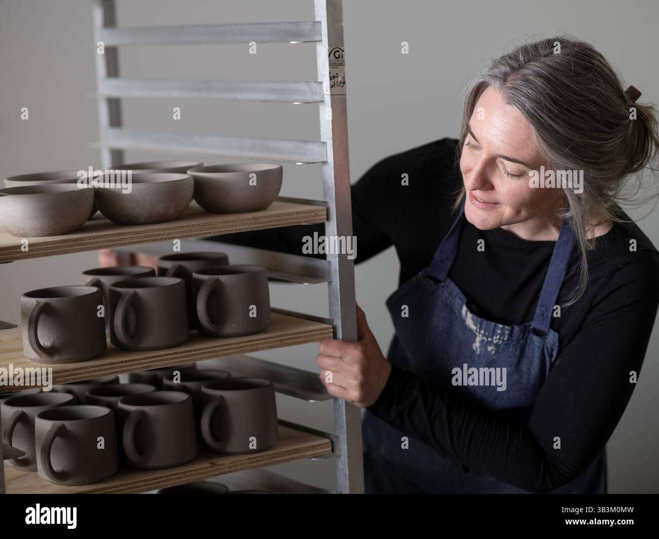 Ceramic artists working in pottery studio Stock Photo