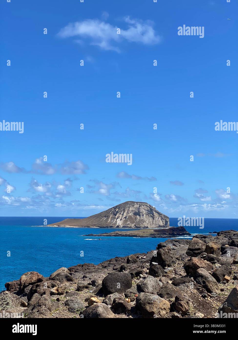 From sunrise to sunset, the ocean in Hawaii never stops performing. - Smartphone Captured Stock Image