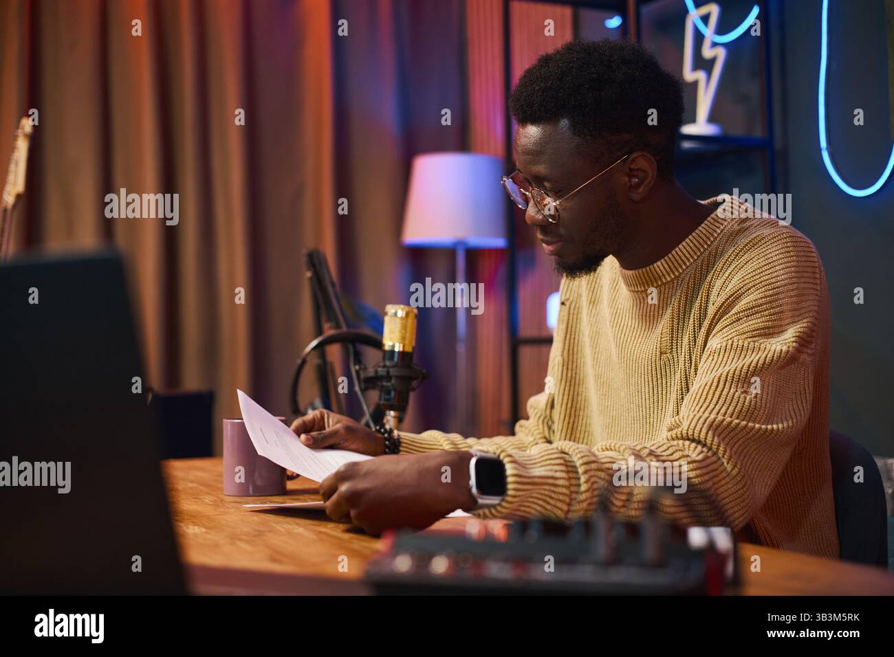 Man Reading Script Before Interview Stock Photo