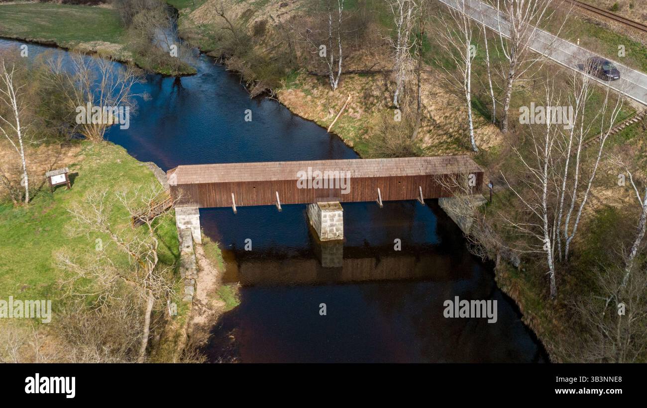 The picturesque covered wooden bridge Rechle near Lenora in the Šumava ...