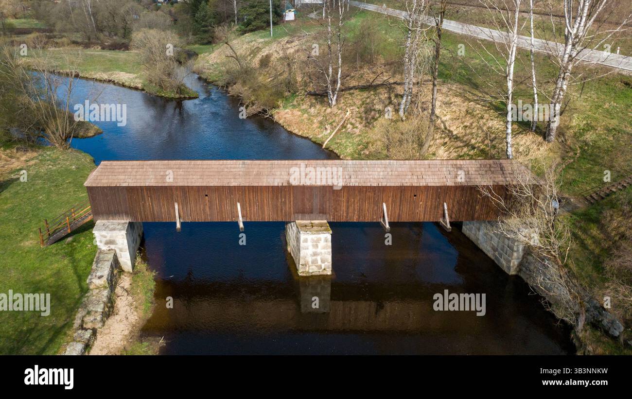 The picturesque covered wooden bridge Rechle near Lenora in the Šumava ...