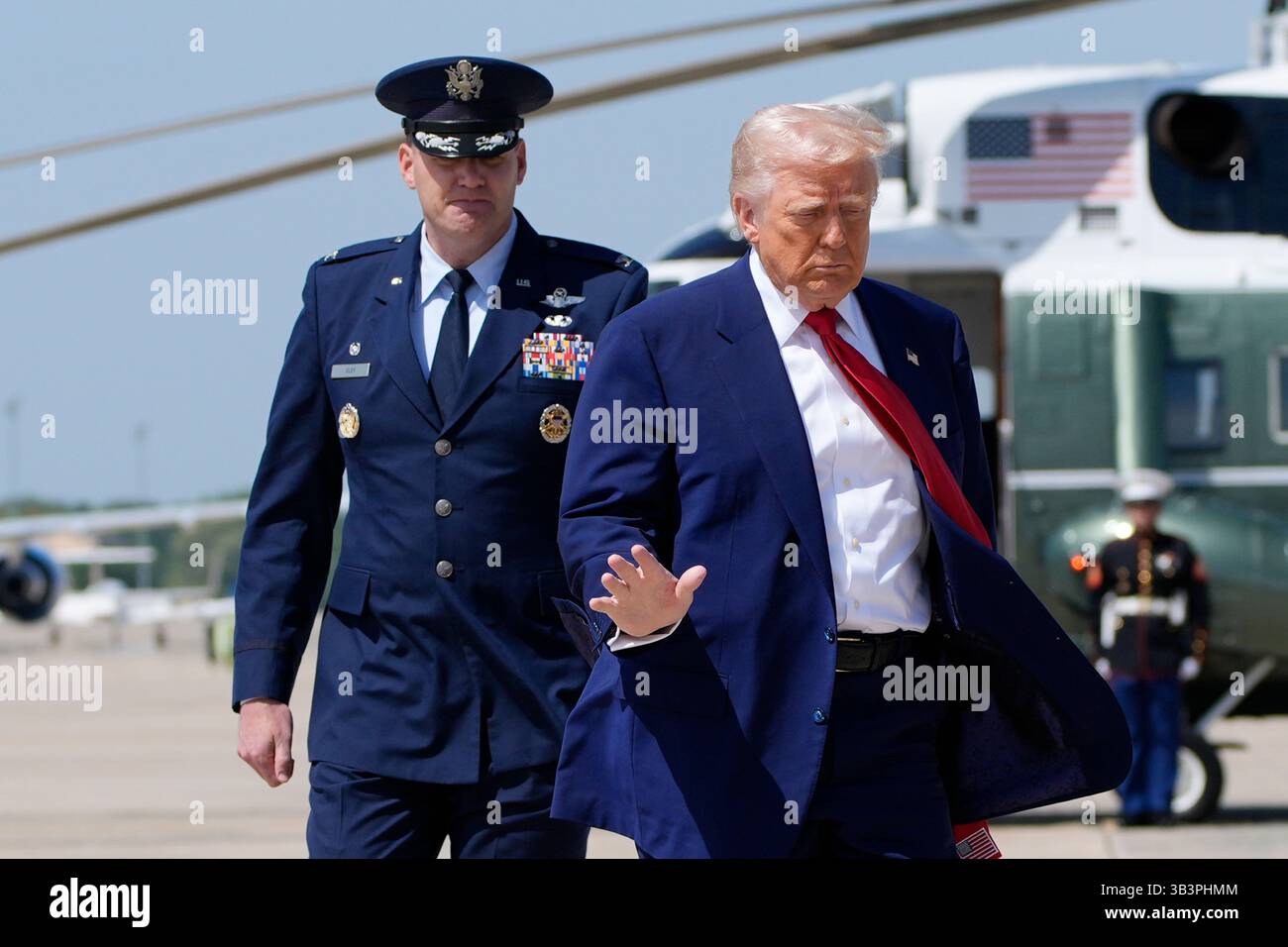 President Donald Trump, right, walks with Col. Kevin Eley, 89th ...