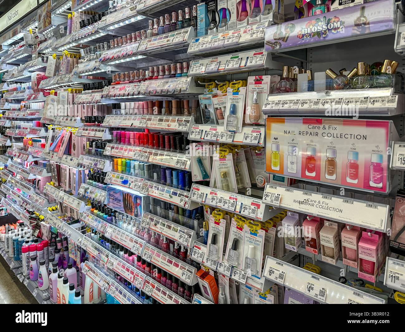 Nail polish and nail products on display at a supermarket - Smartphone Captured Stock Image