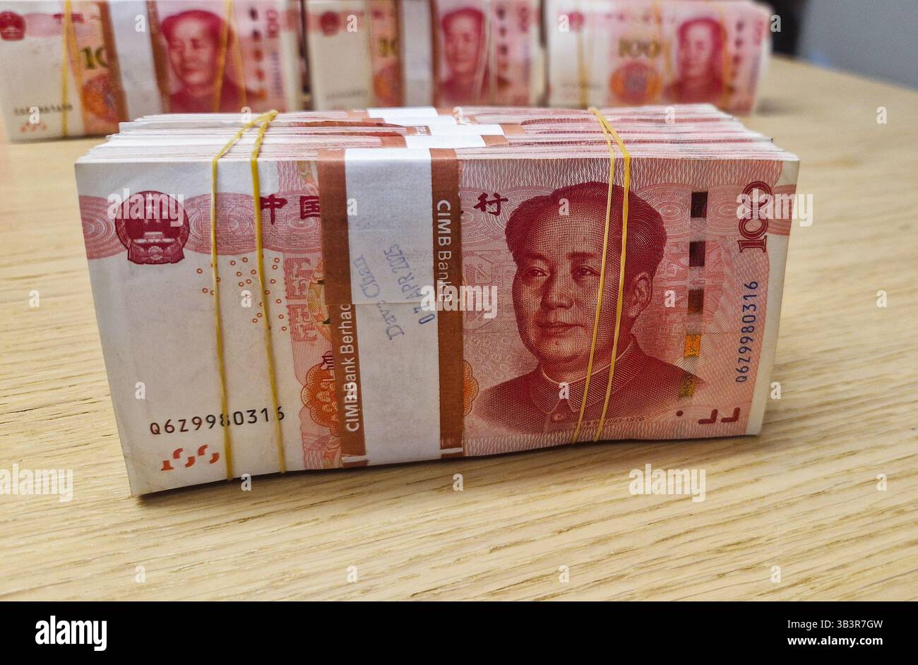 Chinese Yuan renminbi banknotes, paper money, Bank of China currency. Chinese financial system. Income and payments concept. - Smartphone Captured Stock Image