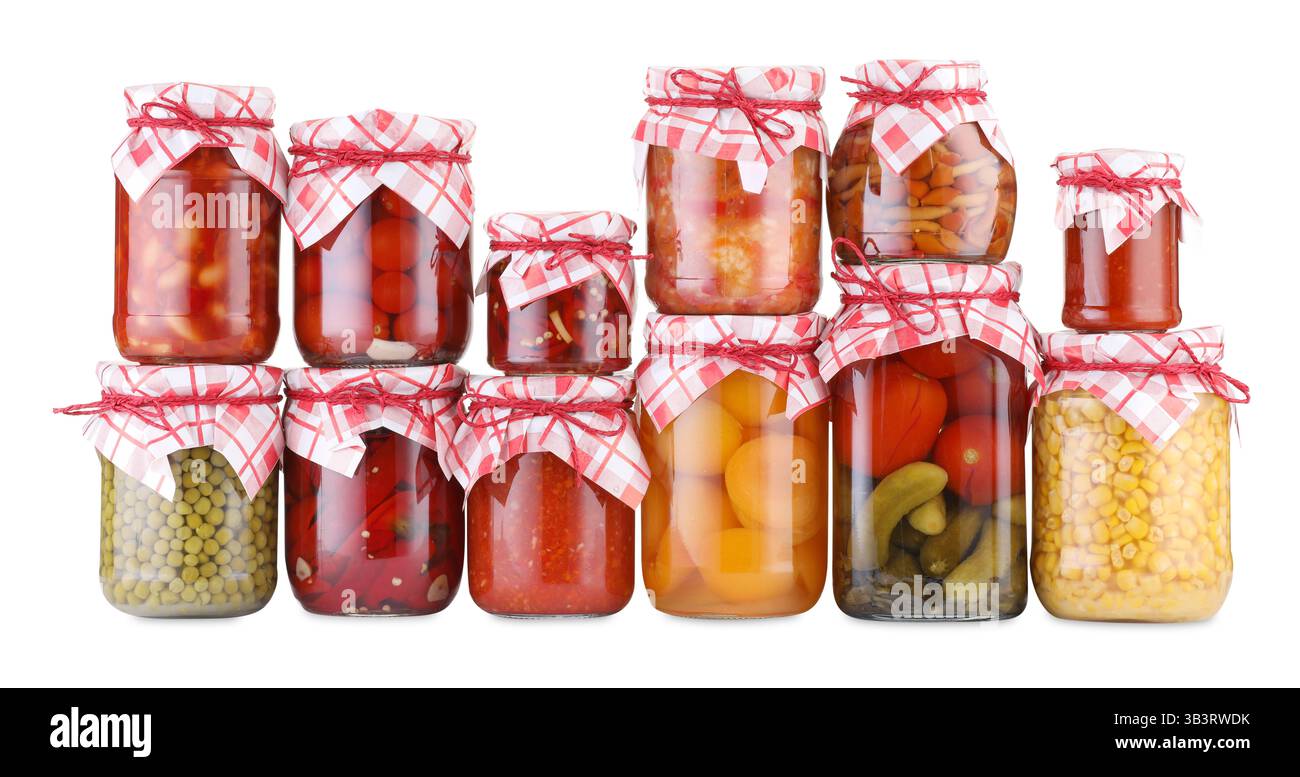Many jars with different pickled products isolated on white Stock Photo