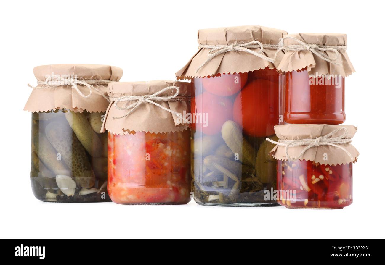 Many jars with different pickled products isolated on white Stock Photo