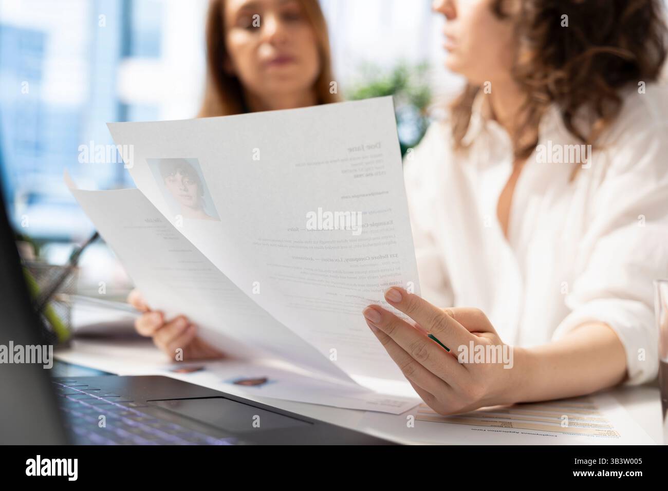 Hr recruiter analyzing cv files - Recruiters Browsing Through Files Hiring For Newly Opened Company Position Looking Over Cvs Matching Job Description Hr Staff Members Analyzing Candidates Resumes In Office 3B3W005