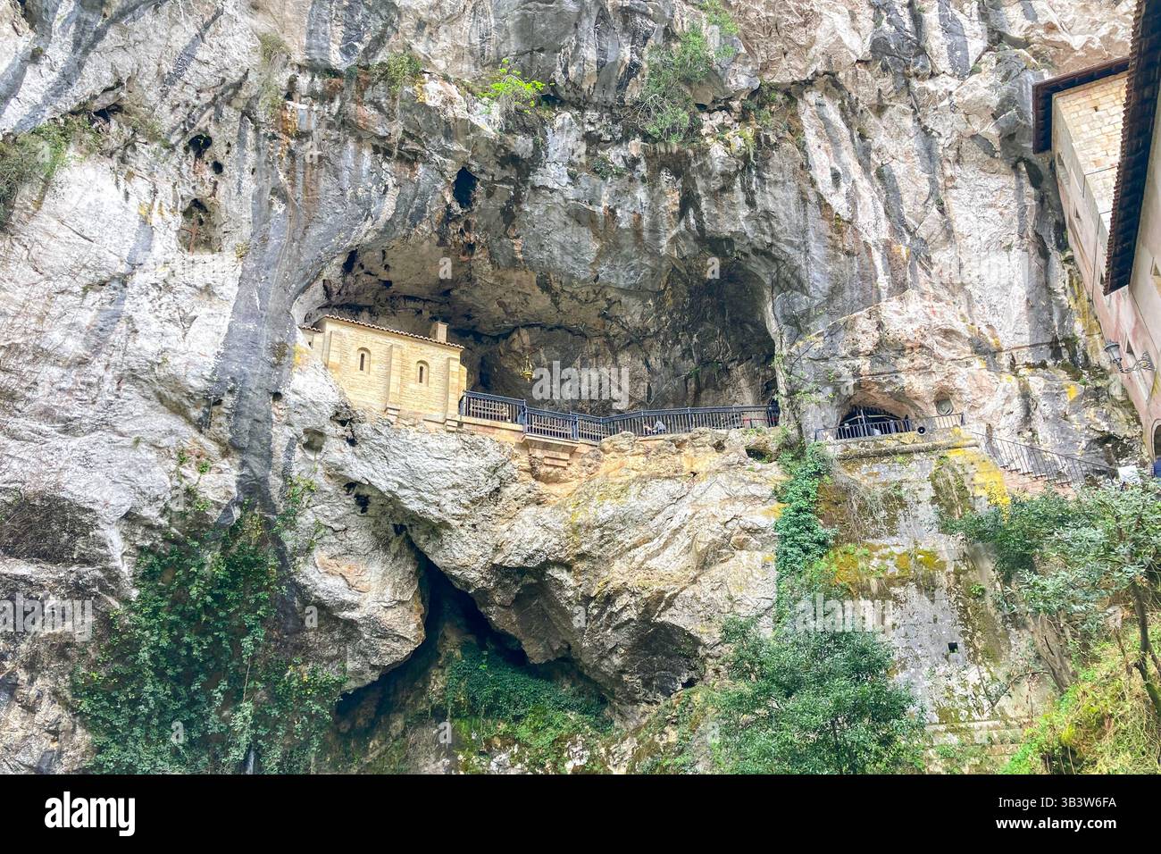 COVADONGA, SPAIN - APRIL  6, 2025: Covadonga in Asturias is a historic mountain village known for its sacred cave, basilica - Smartphone Captured Stock Image