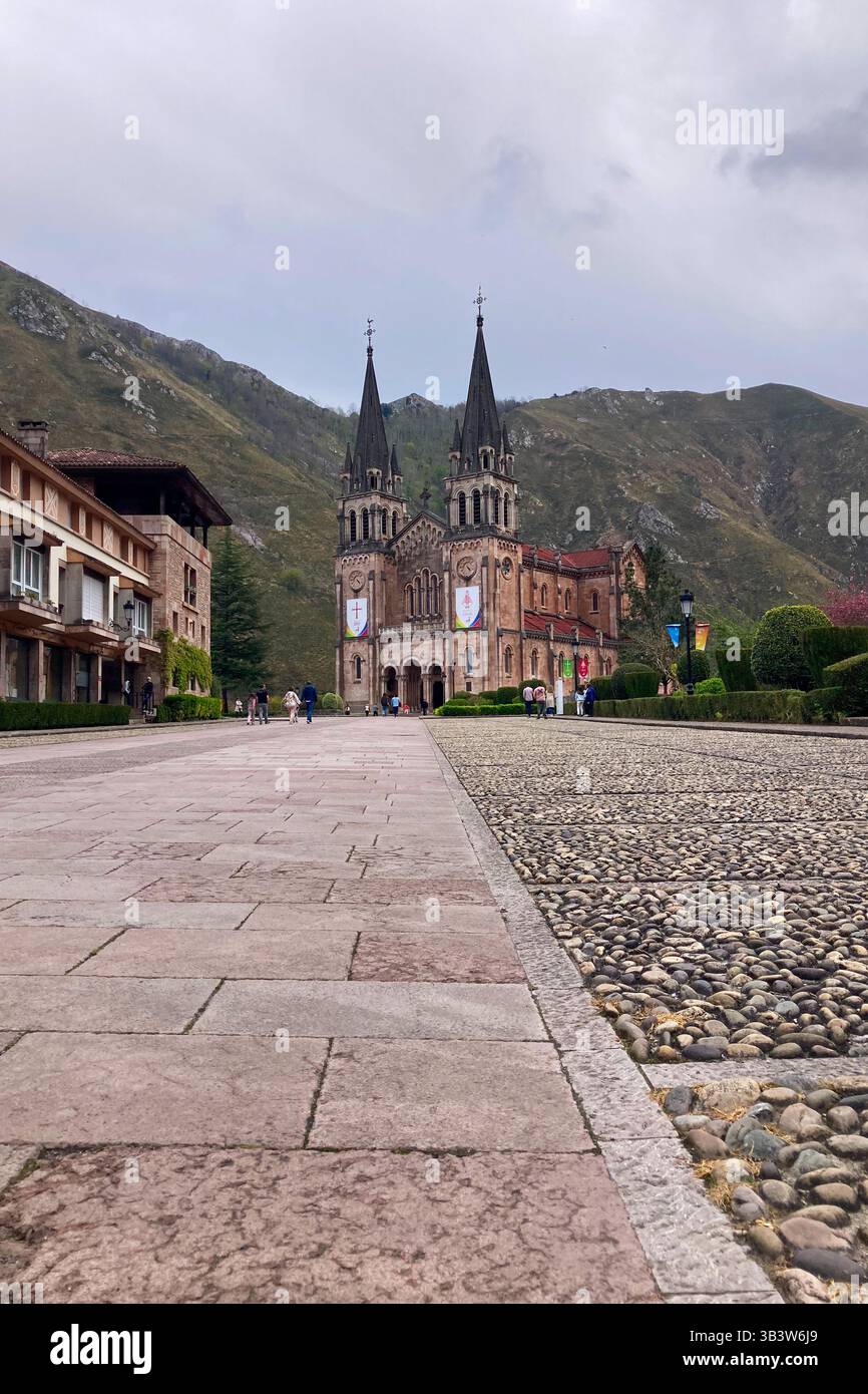 COVADONGA, SPAIN - APRIL  6, 2025: Covadonga in Asturias is a historic mountain village known for its sacred cave, basilica - Smartphone Captured Stock Image