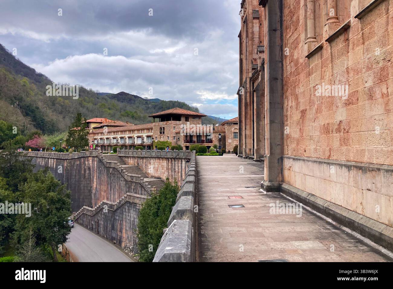 COVADONGA, SPAIN - APRIL  6, 2025: Covadonga in Asturias is a historic mountain village known for its sacred cave, basilica - Smartphone Captured Stock Image