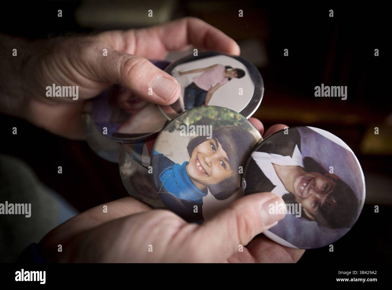 July 9, 2015 - Euless, TX, USA - Steve Roberts holds pictures of his daughter Kelsey at his home in Euless, Texas, on Thursday, July 9, 2015. Roberts is a volunteer for the Compassionate Friends conference for grieving parents and families in the death of children. His daughter, Kelsey, 11, was smothered by her mother at their home on Aug. 5, 2005. (Credit Image: © Joyce Marshall/TNS/ZUMA Wire) Stock Photo