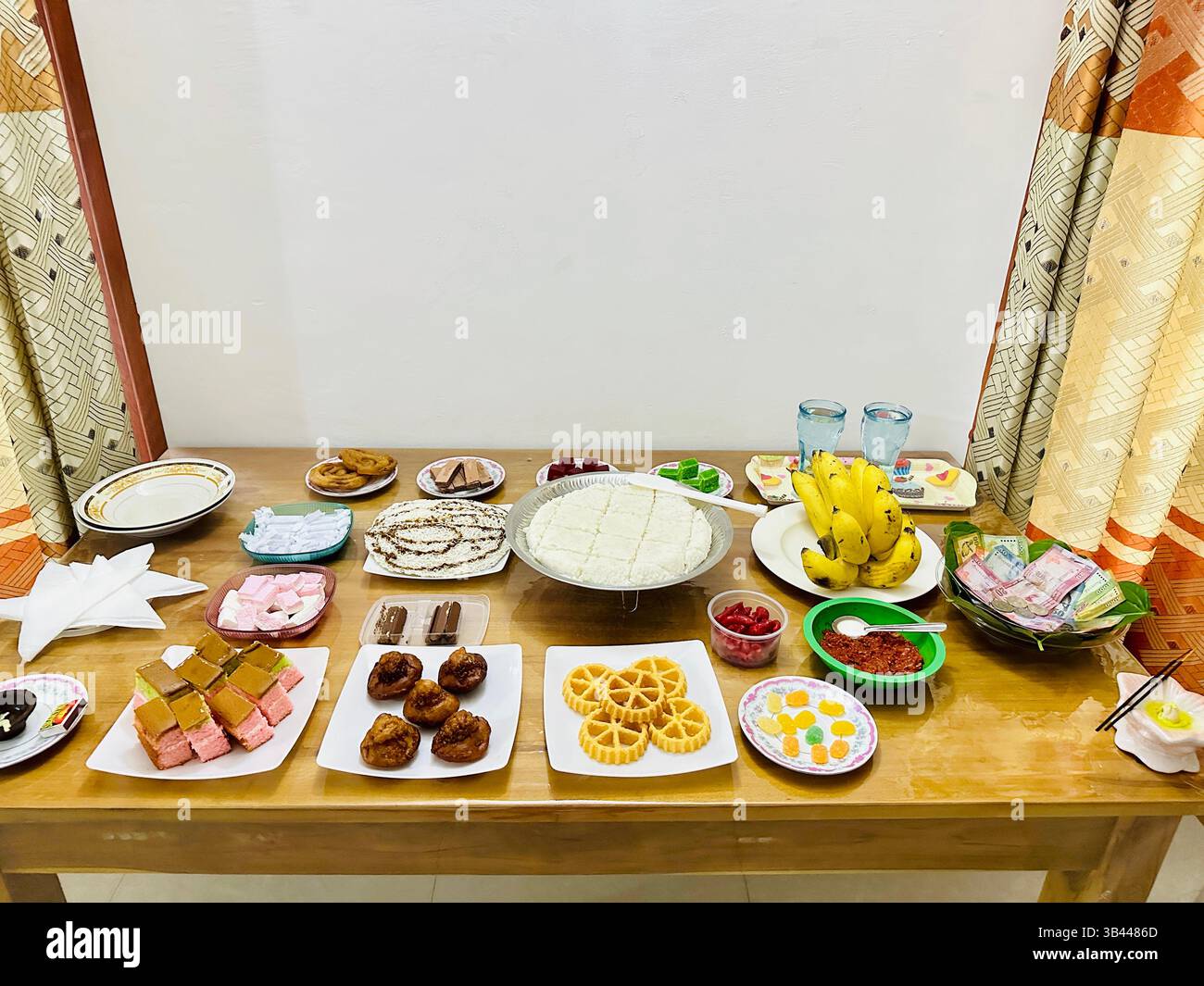 A festive table filled with traditional Sri Lankan Aurudu foods, showcasing rich culture, heritage, and New Year culinary traditions. - Smartphone Captured Stock Image