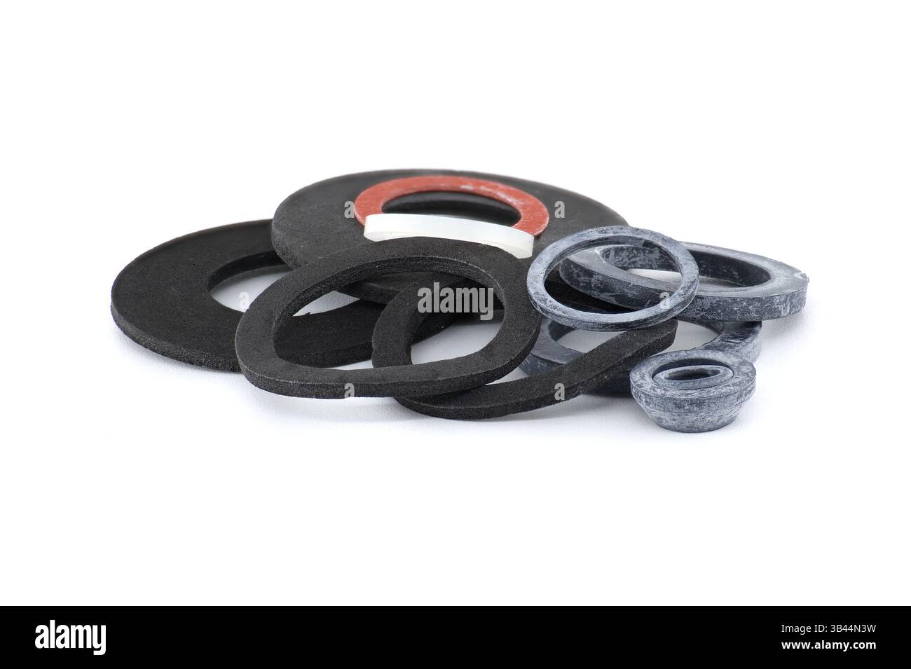 A collection of various rubber washers in different sizes and colors ...