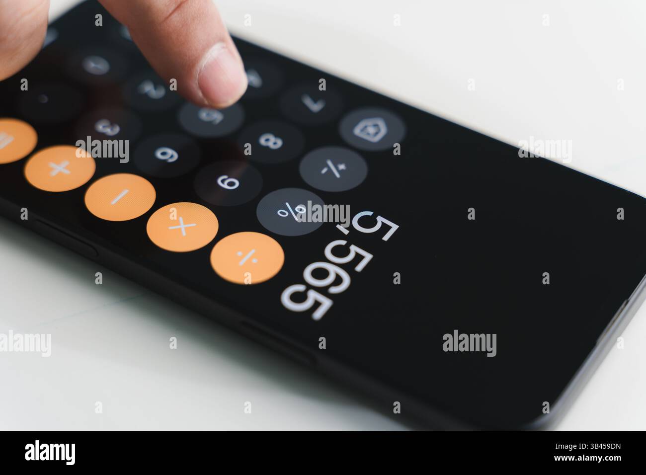 man accountant working on desk using calculator calculate while working analytic Accounting Stock Photo