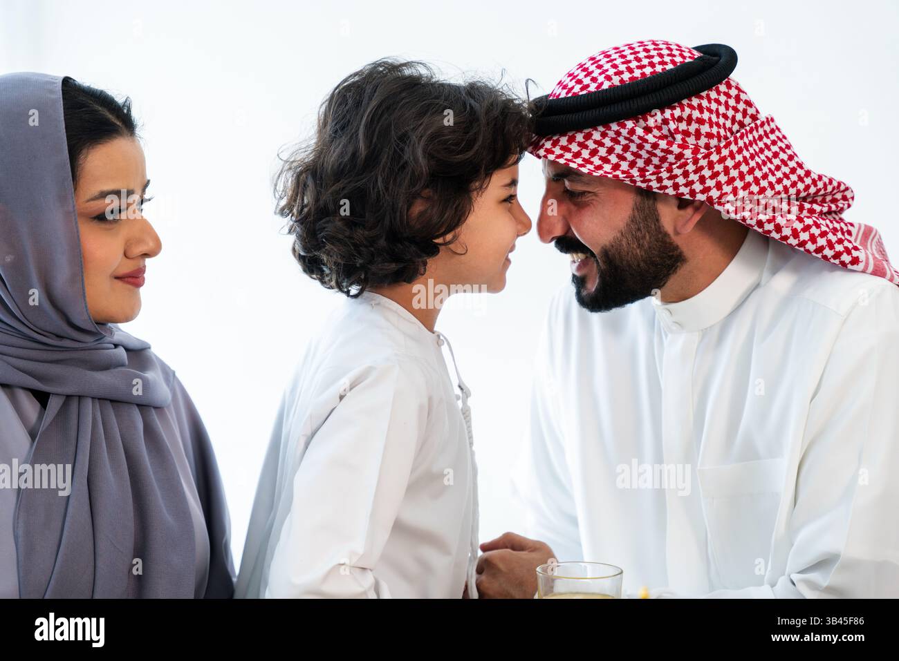Happy Rabai Happy arab family wearing saudi arabia clothing spending time together ...