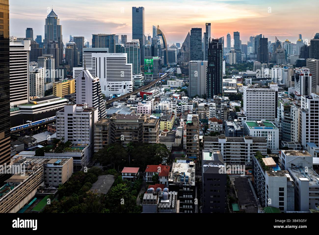 Bangkok high rise city centre buildings skyline at sunset, Thailand ...