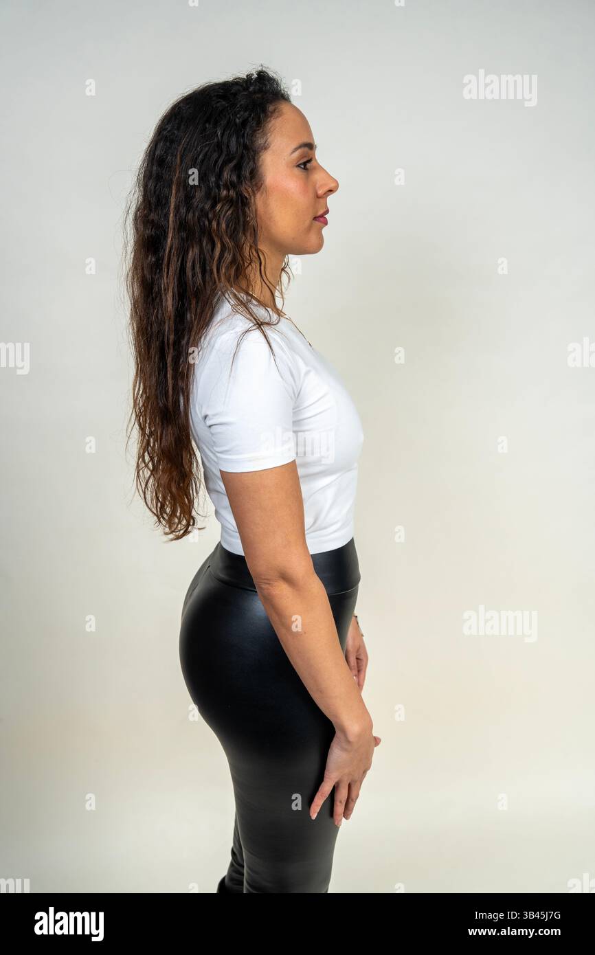 Fitness model showcasing comfortable and stylish activewear in a studio setting Stock Photo